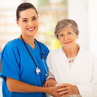 Holding hands with the caregiver and her patient